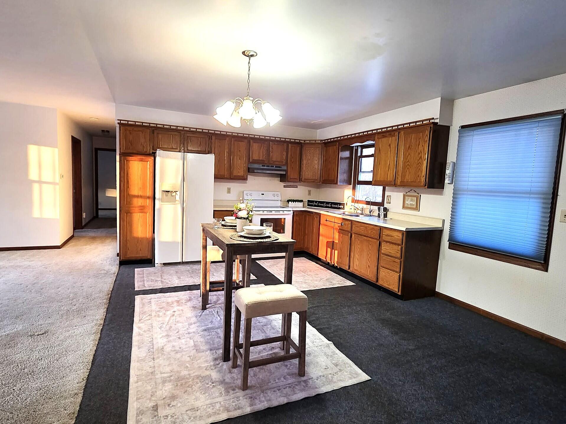 710 Madison Street Bellevue, MI 49021 - Photo 6 of 33 kitchenfromgarage