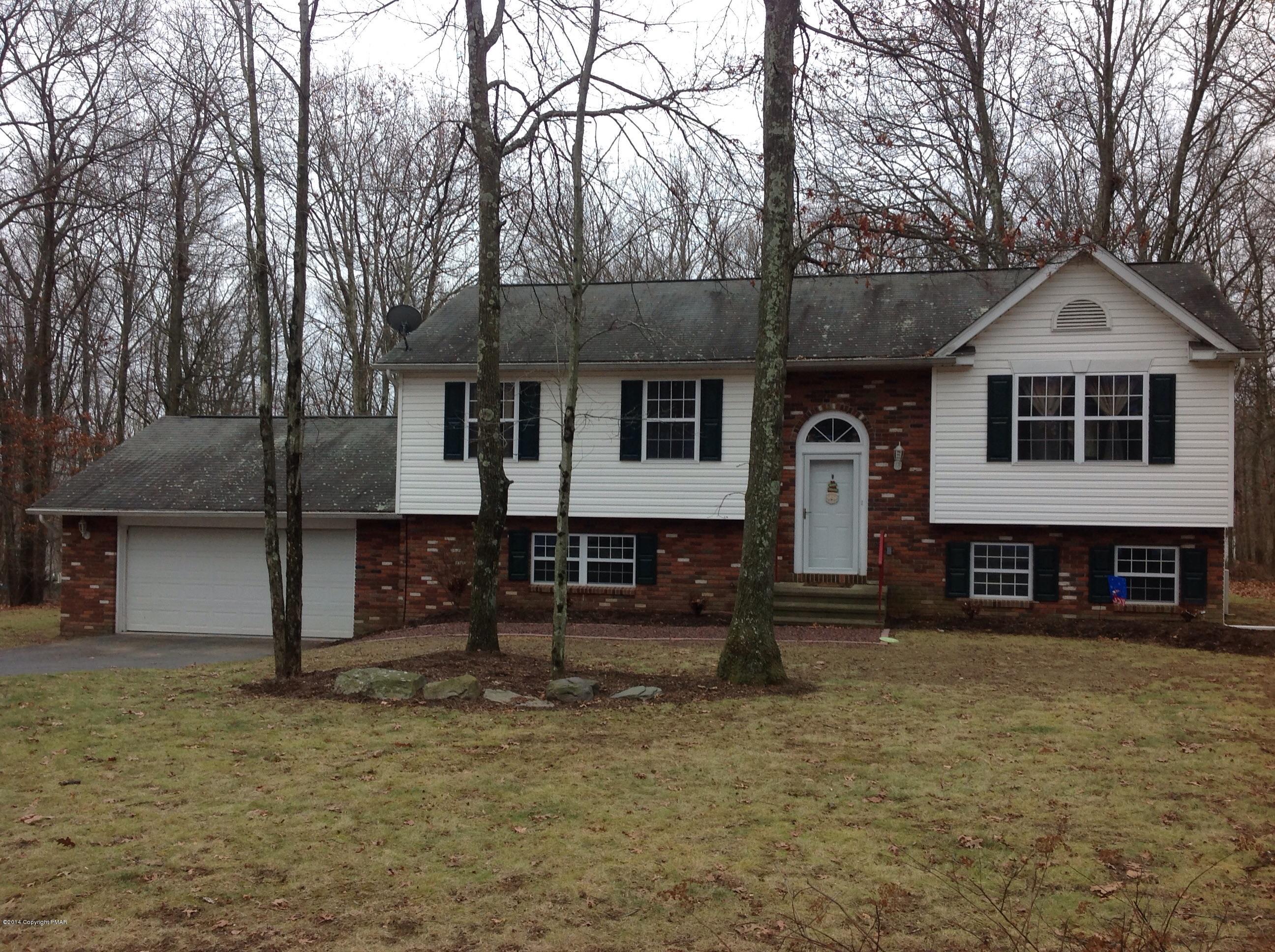 192 Timber Hill Road Henryville, PA 18332 - Photo 1 of 24 a front view of a house with garden