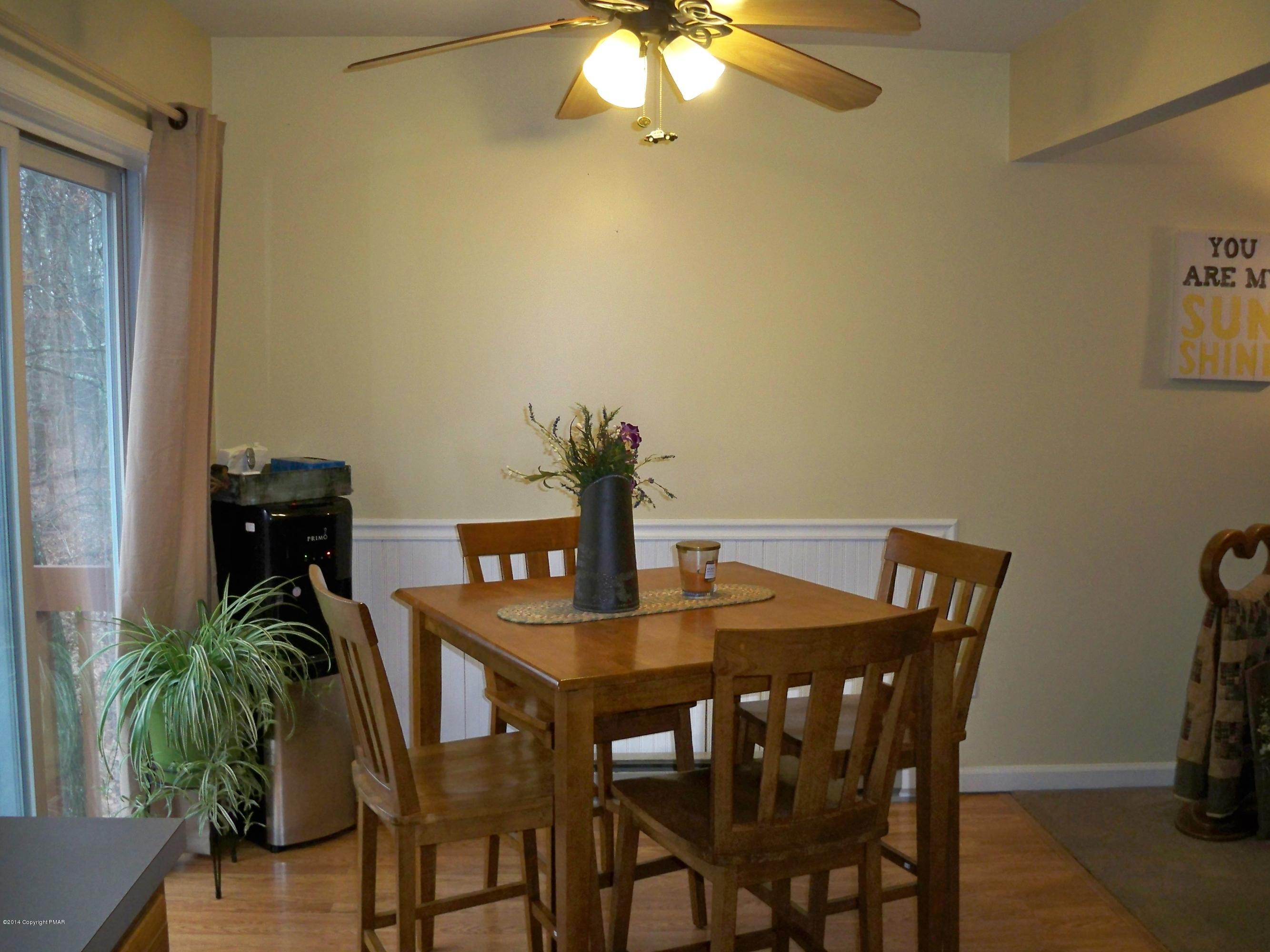 192 Timber Hill Road Henryville, PA 18332 - Photo 14 of 24 a view of a dining room with furniture and chandelier