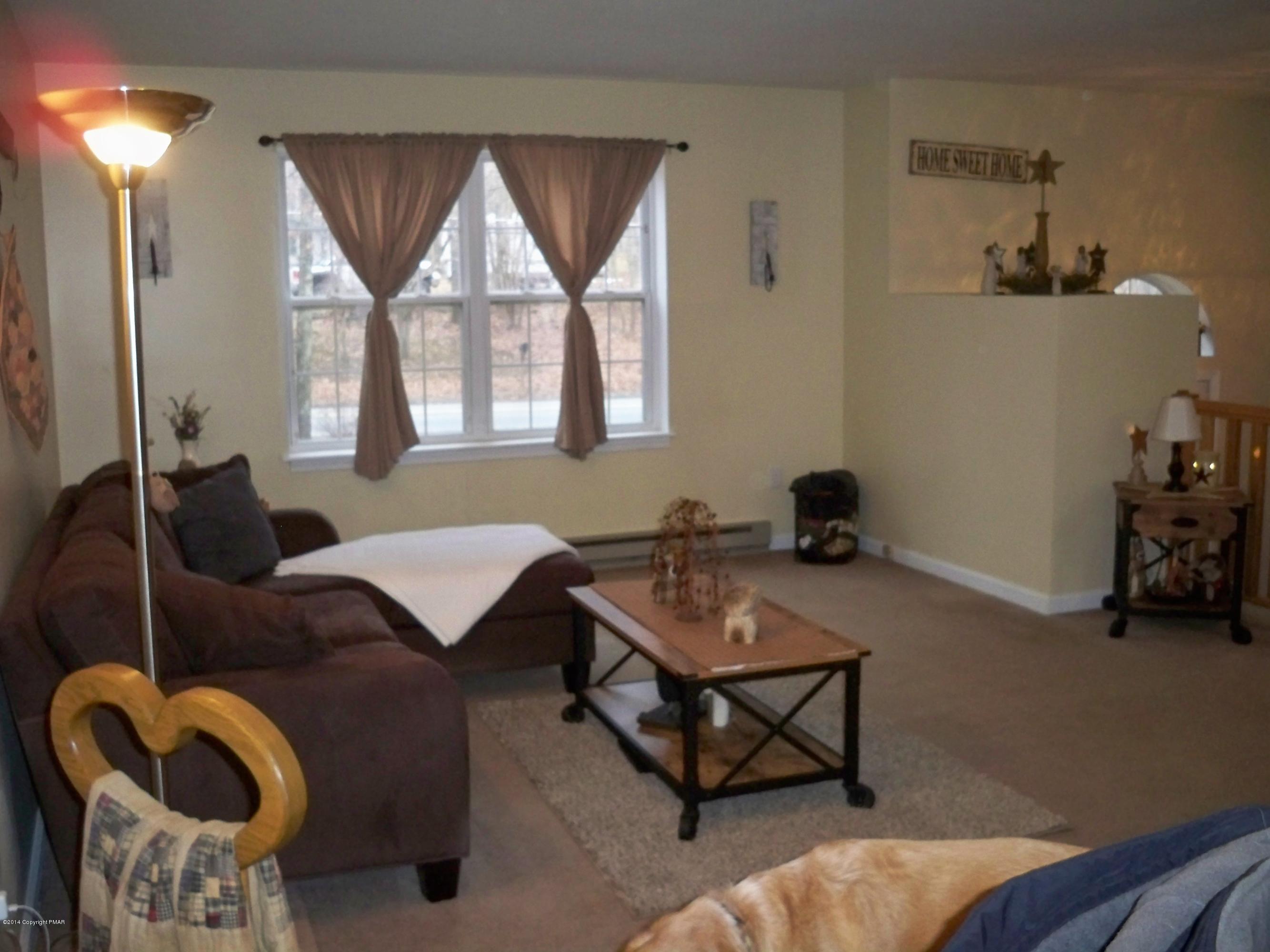 192 Timber Hill Road Henryville, PA 18332 - Photo 3 of 24 a living room with furniture and a window