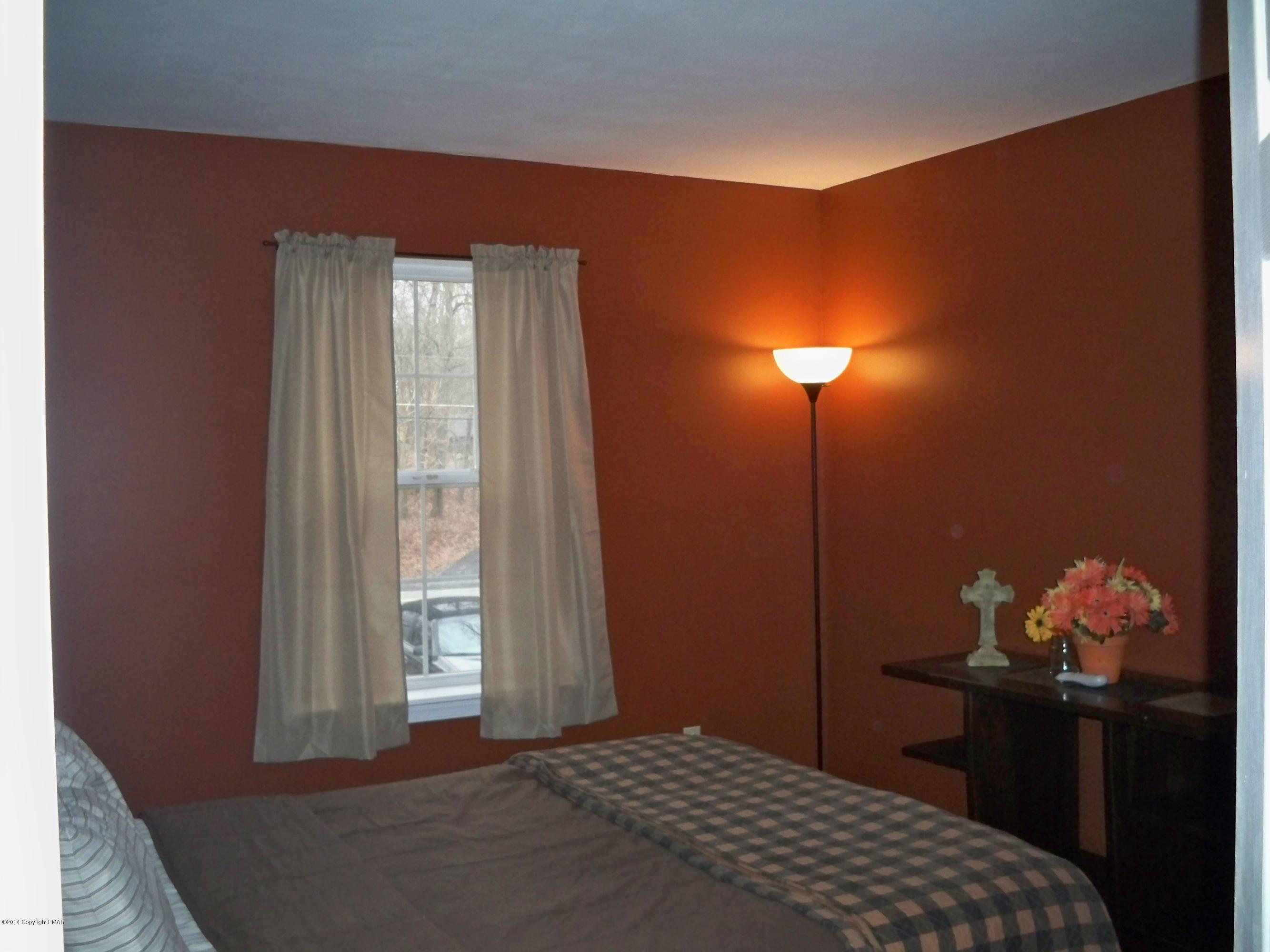 192 Timber Hill Road Henryville, PA 18332 - Photo 8 of 24 a bedroom with a bed and a window