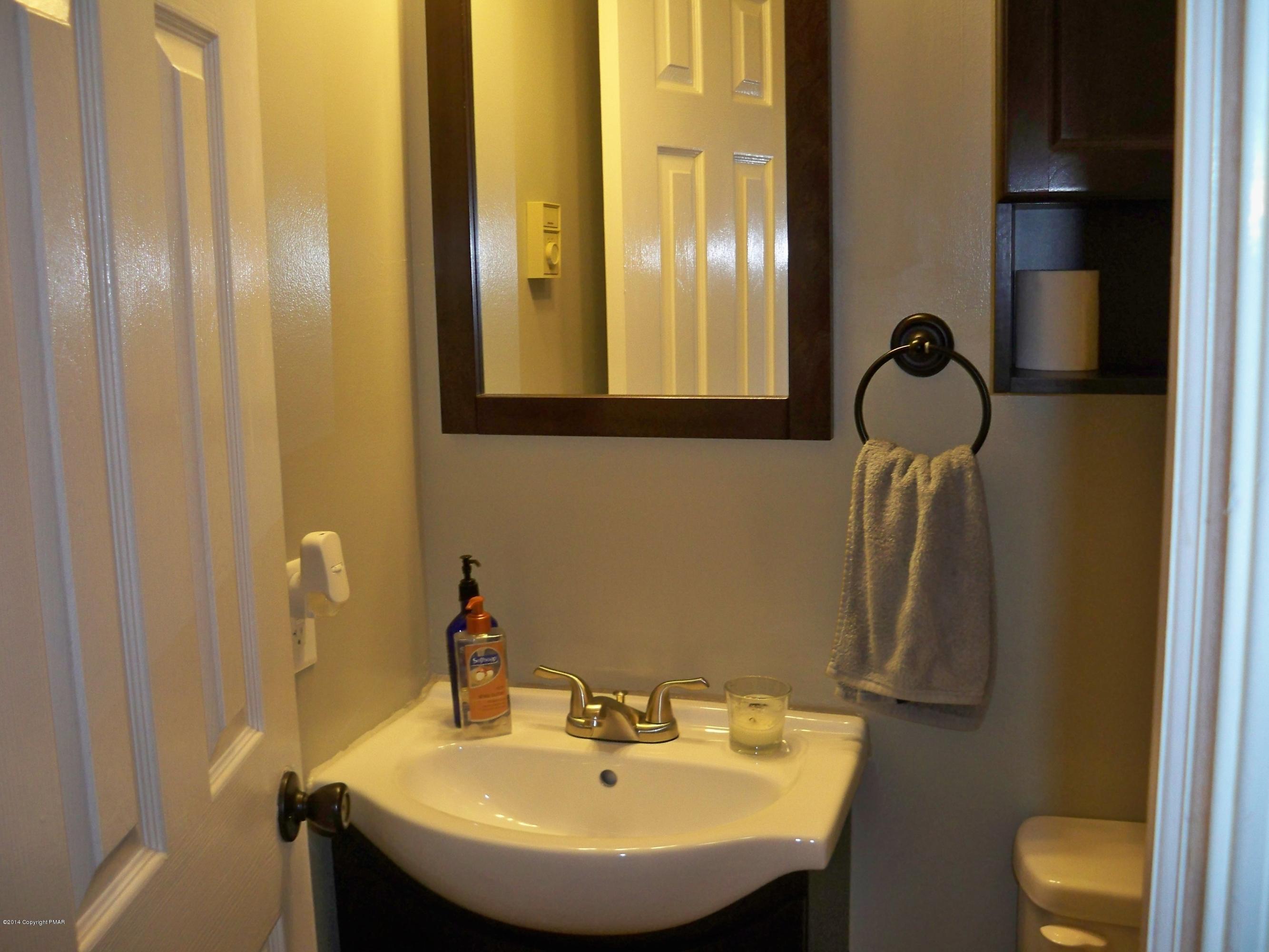 192 Timber Hill Road Henryville, PA 18332 - Photo 10 of 24 a bathroom with a sink and a mirror