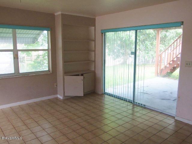 971 Bali Road Cocoa Beach, FL 32931 - Photo 5 of 8 family room p1