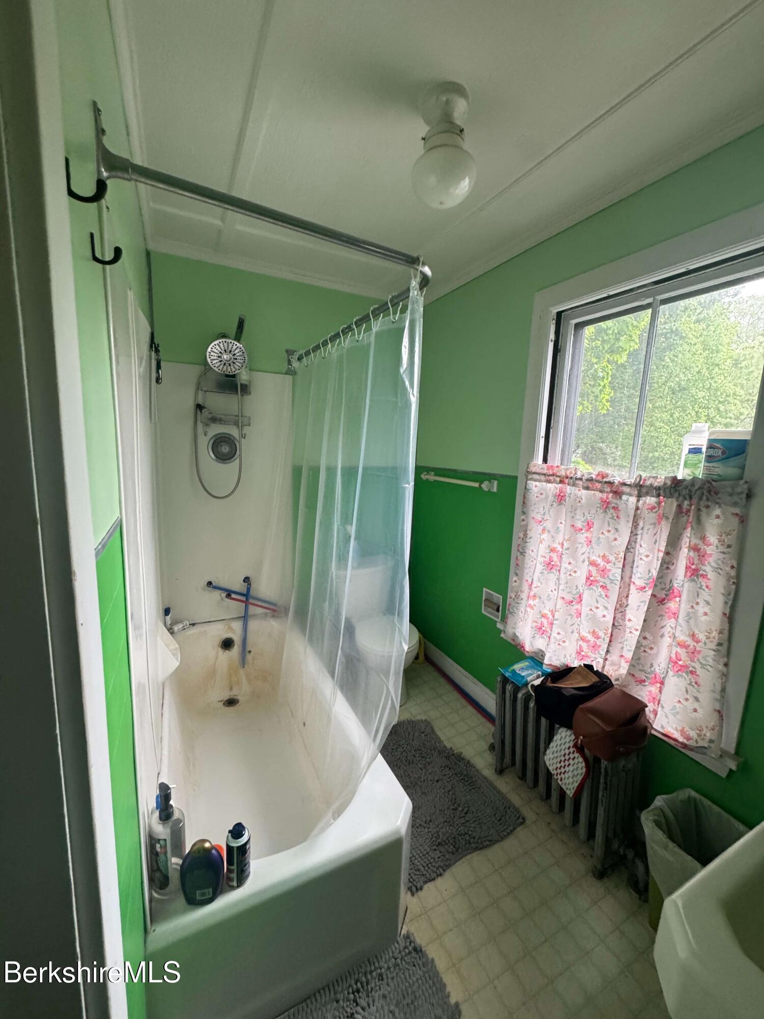 77 Front Street North Adams, MA 01247 - Photo 14 of 16 a bathroom with a sink a toilet and a tub