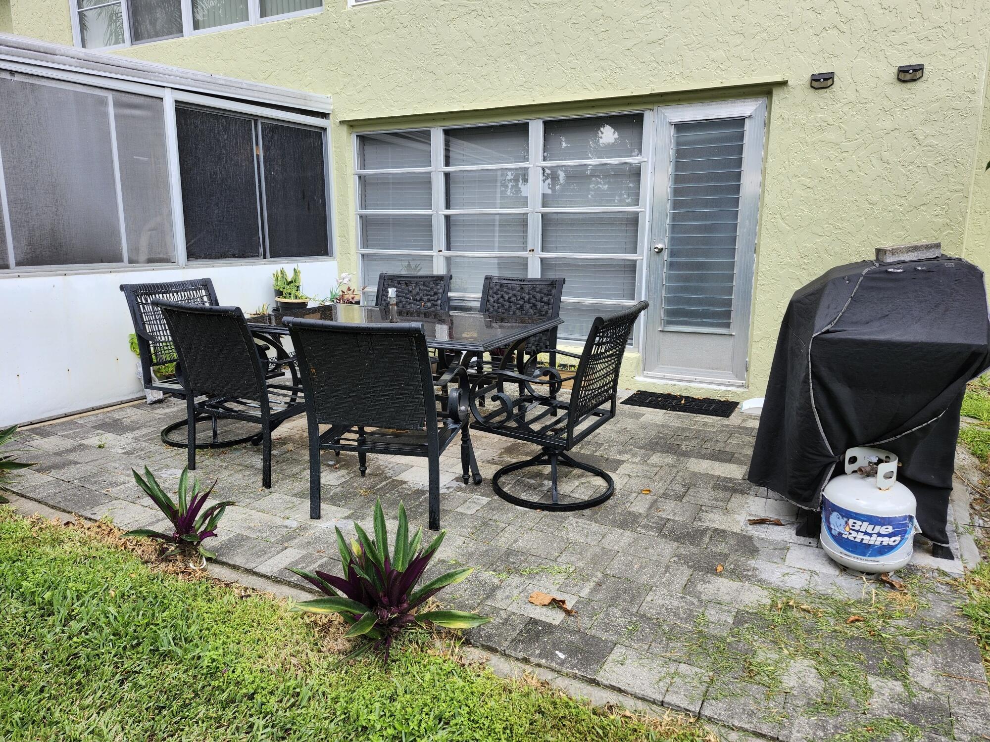 1141 Calamondin Terrace, Unit 101 Delray Beach, FL 33445 - Photo 17 of 21 a view of a dining room with furniture