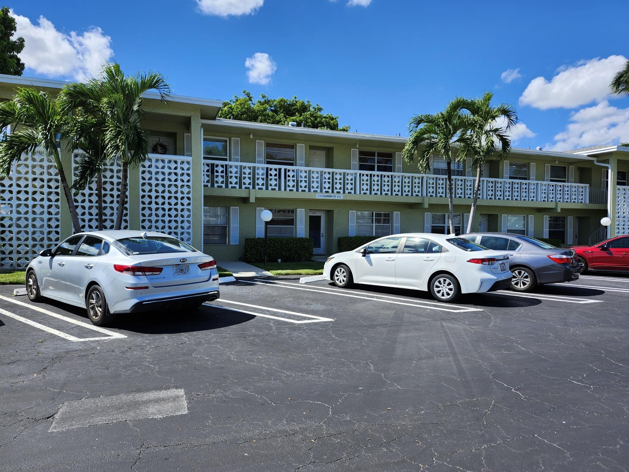 1141 Calamondin Terrace, Unit 101 Delray Beach, FL 33445 - Photo 2 of 21 a car parked in front of a house