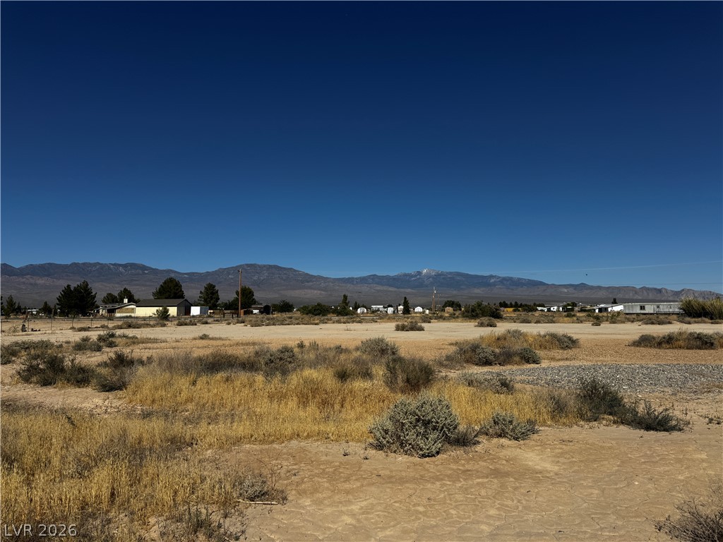 3090 Gally Road Pahrump, NV 89060 - Photo 8 of 20 A spacious desert landscape offers clear mountain views and a prime building location.