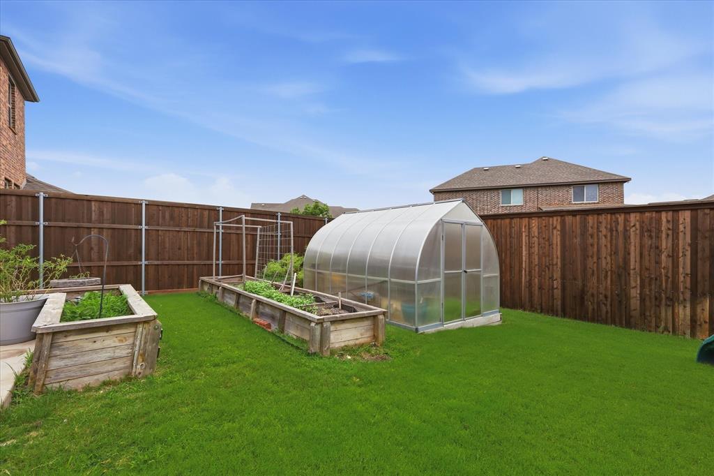 1105 Safrano Street Midlothian, TX 76065 - Photo 20 of 25 a garden view with a seating space