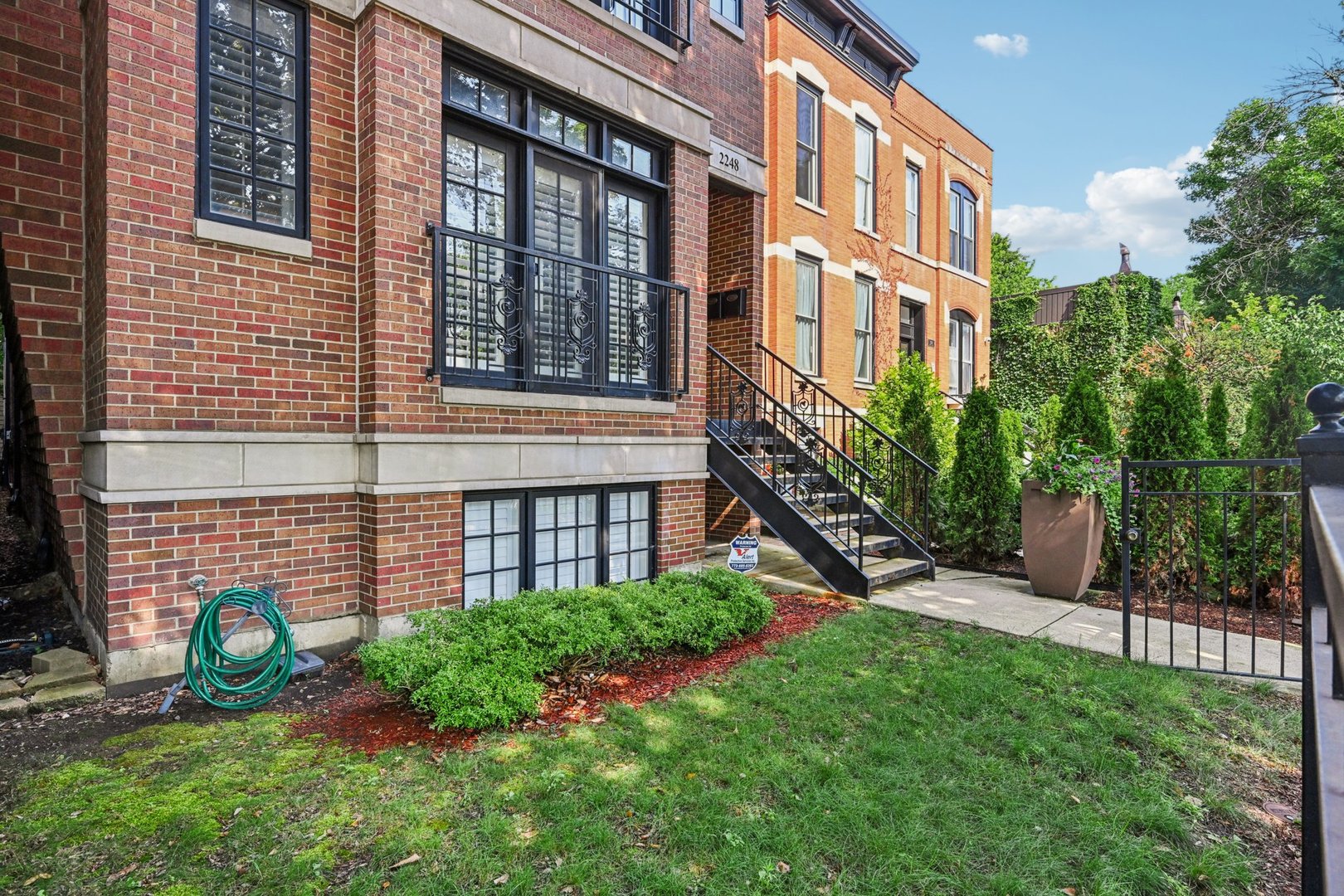 2248 North Racine Avenue, Unit 3 Chicago, IL 60614 - Photo 2 of 32 a view of a building with a yard and plants