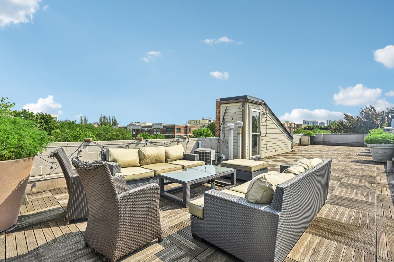 2248 North Racine Avenue, Unit 3 Chicago, IL 60614 - Photo 22 of 32 a view of a roof deck with couches and sky view