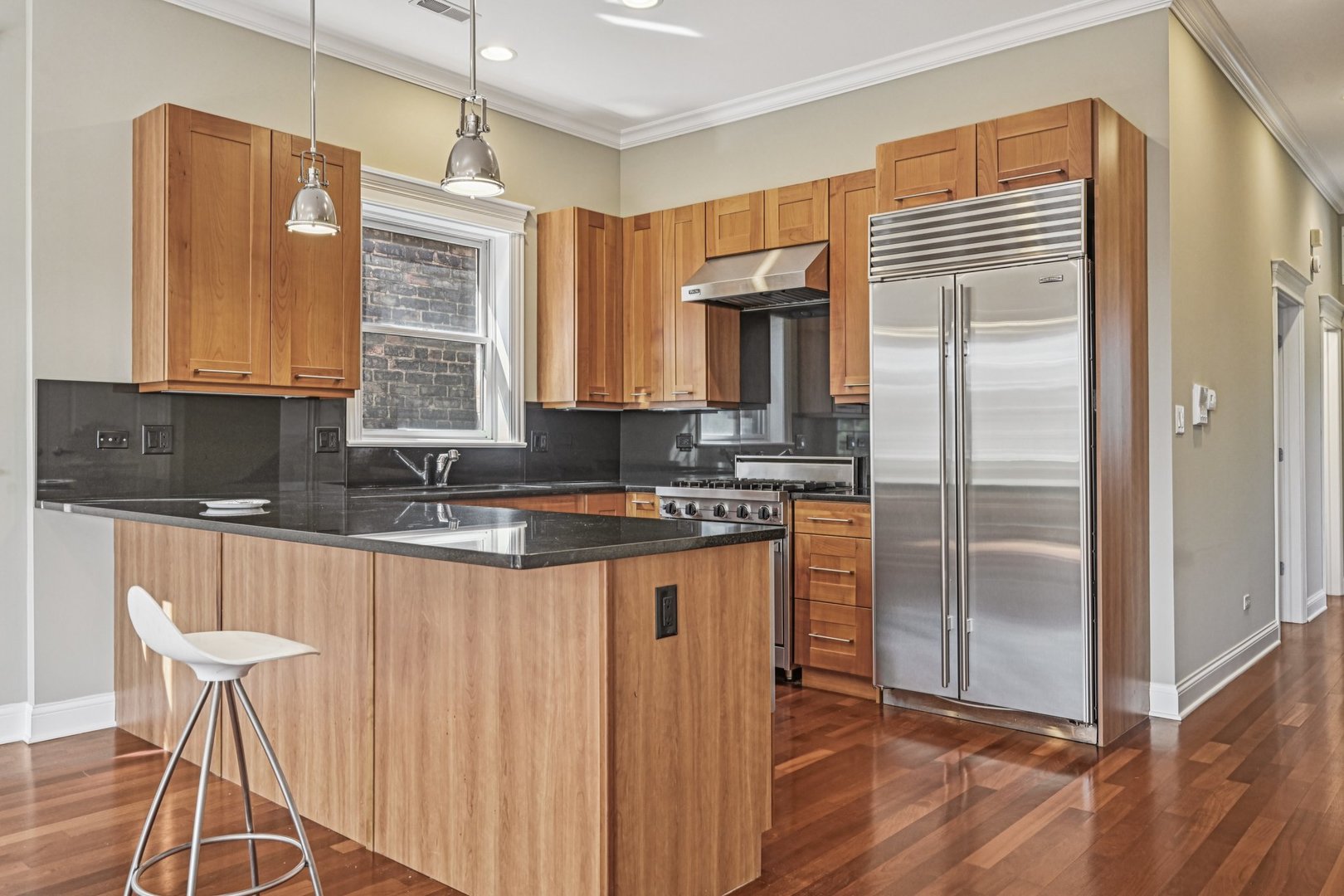 2248 North Racine Avenue, Unit 3 Chicago, IL 60614 - Photo 6 of 32 a kitchen with stainless steel appliances granite countertop a refrigerator a sink and white cabinets