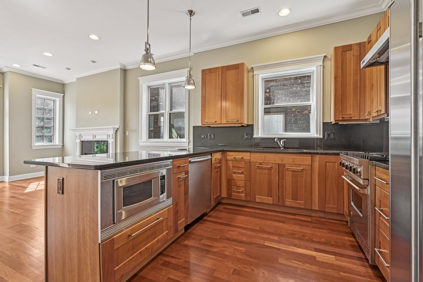 2248 North Racine Avenue, Unit 3 Chicago, IL 60614 - Photo 8 of 32 a kitchen with stainless steel appliances granite countertop a stove and a sink