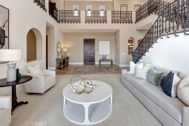 a bathroom with a granite countertop toilet sink and mirror