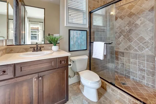 a kitchen with stainless steel appliances granite countertop a stove top oven a sink a counter top space and cabinets