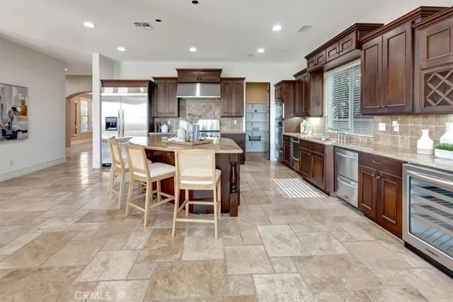 a view of a hallway with a livingroom with furniture