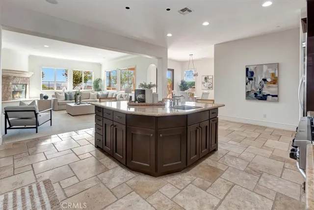 a living room with furniture a rug and white walls