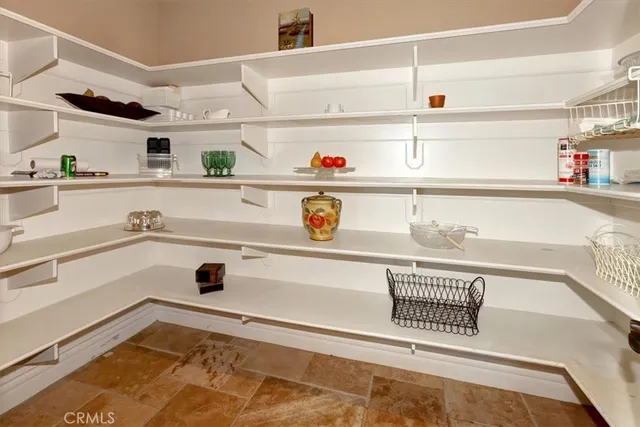 a spacious bedroom with a bed and a fireplace