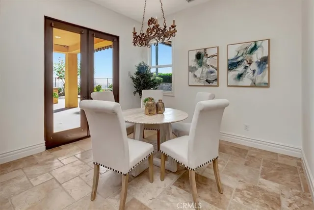 a large bed sitting in a spacious bedroom next to a window