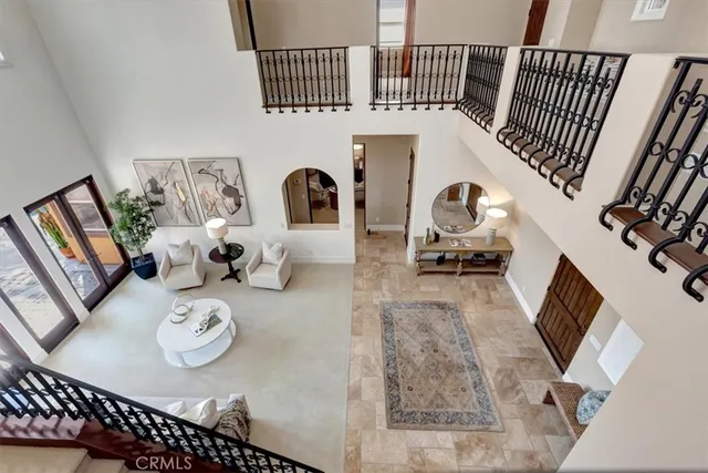 a bedroom with a bed lamp and window