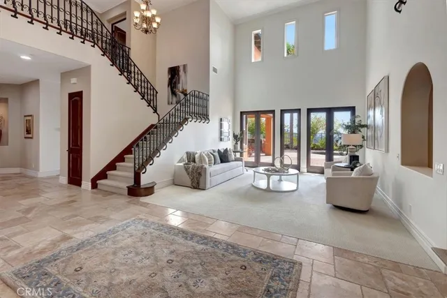 a view of hall way with furniture and staircase