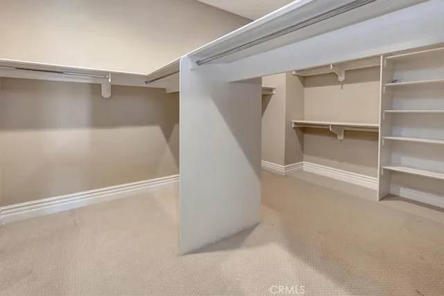 a view of a house with a tub and potted plants