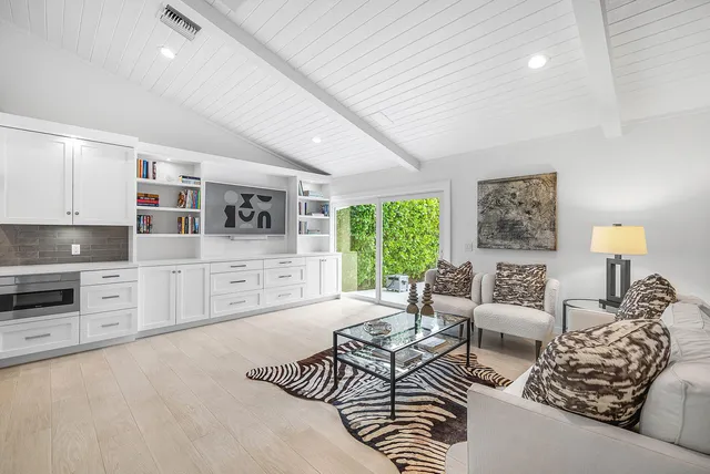 a spacious bedroom with a bed and a walk in closet