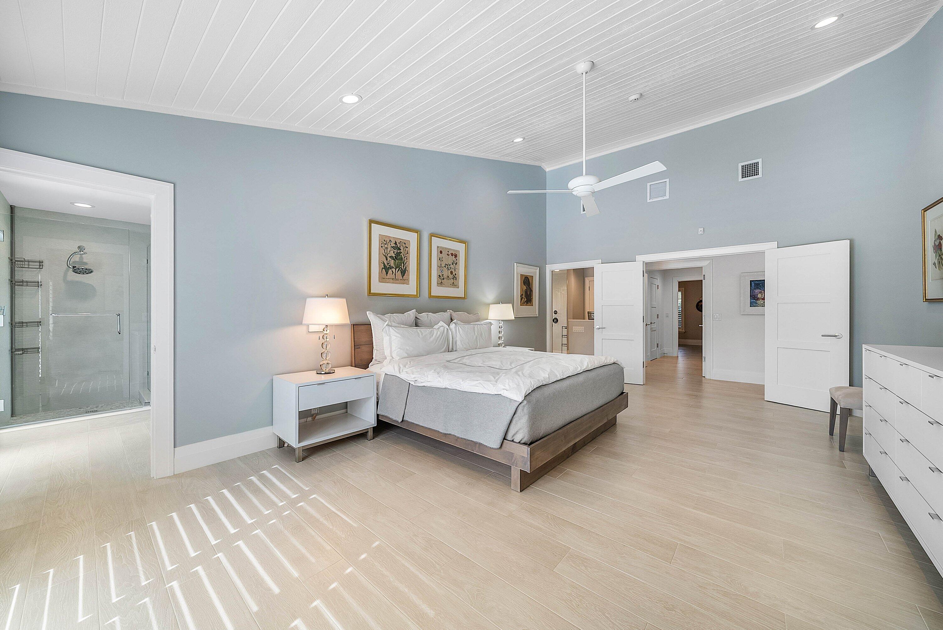 4199 Bocaire Boulevard Boca Raton, FL 33487 - Photo 26 of 82 a spacious bedroom with a bed and a walk in closet