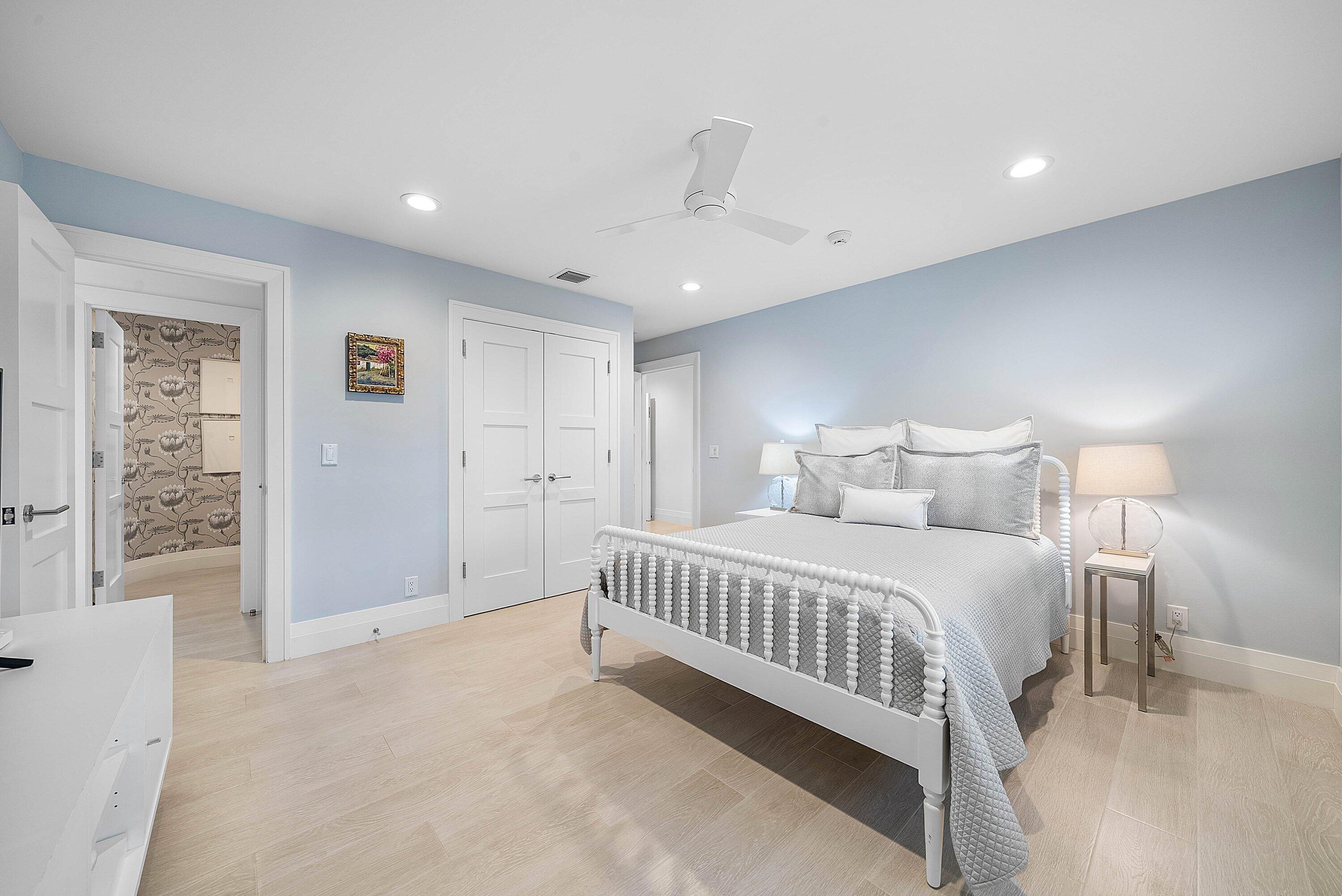 4199 Bocaire Boulevard Boca Raton, FL 33487 - Photo 35 of 82 a spacious bedroom with a bed and a walk in closet