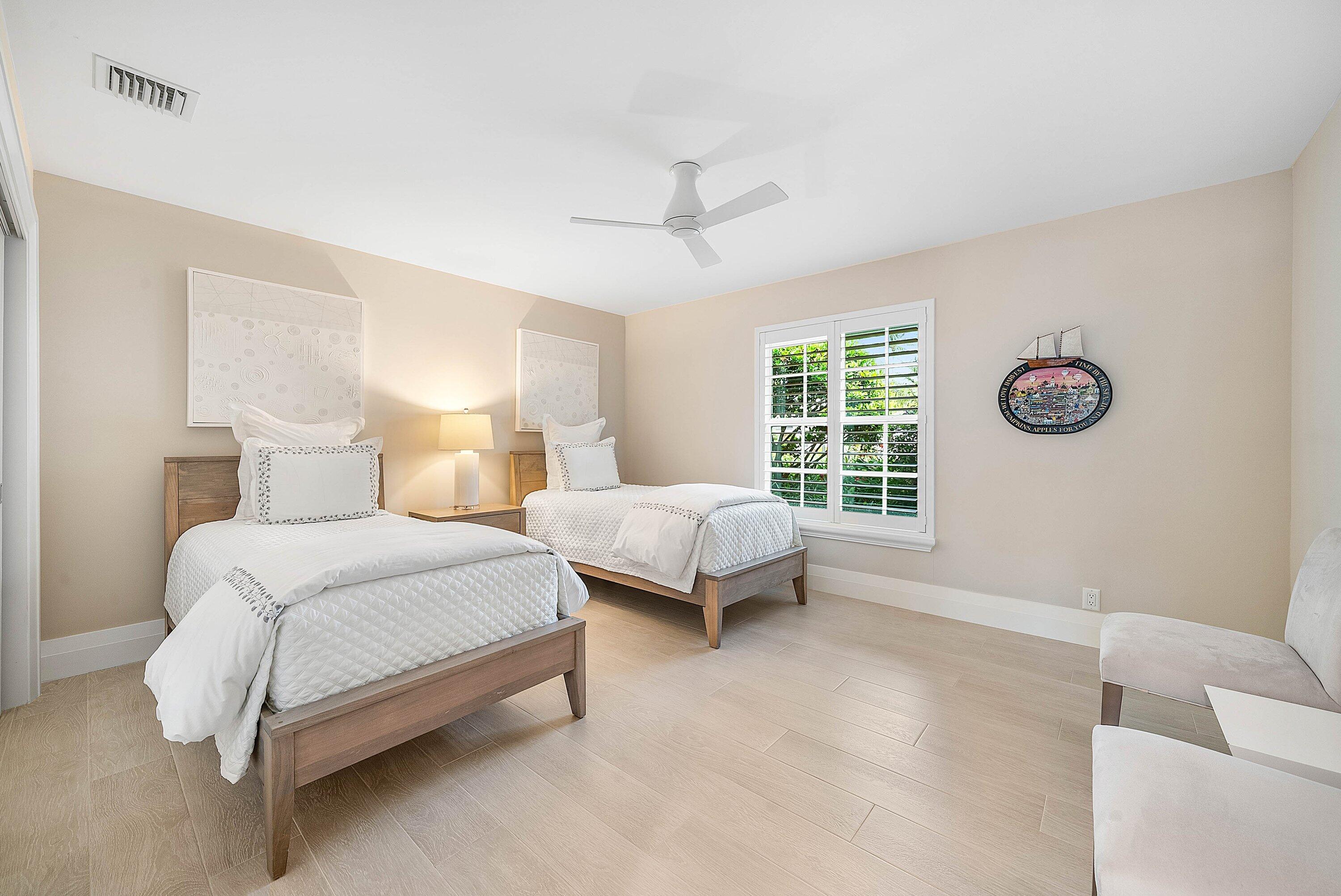 4199 Bocaire Boulevard Boca Raton, FL 33487 - Photo 39 of 82 a bedroom with a bed and a window