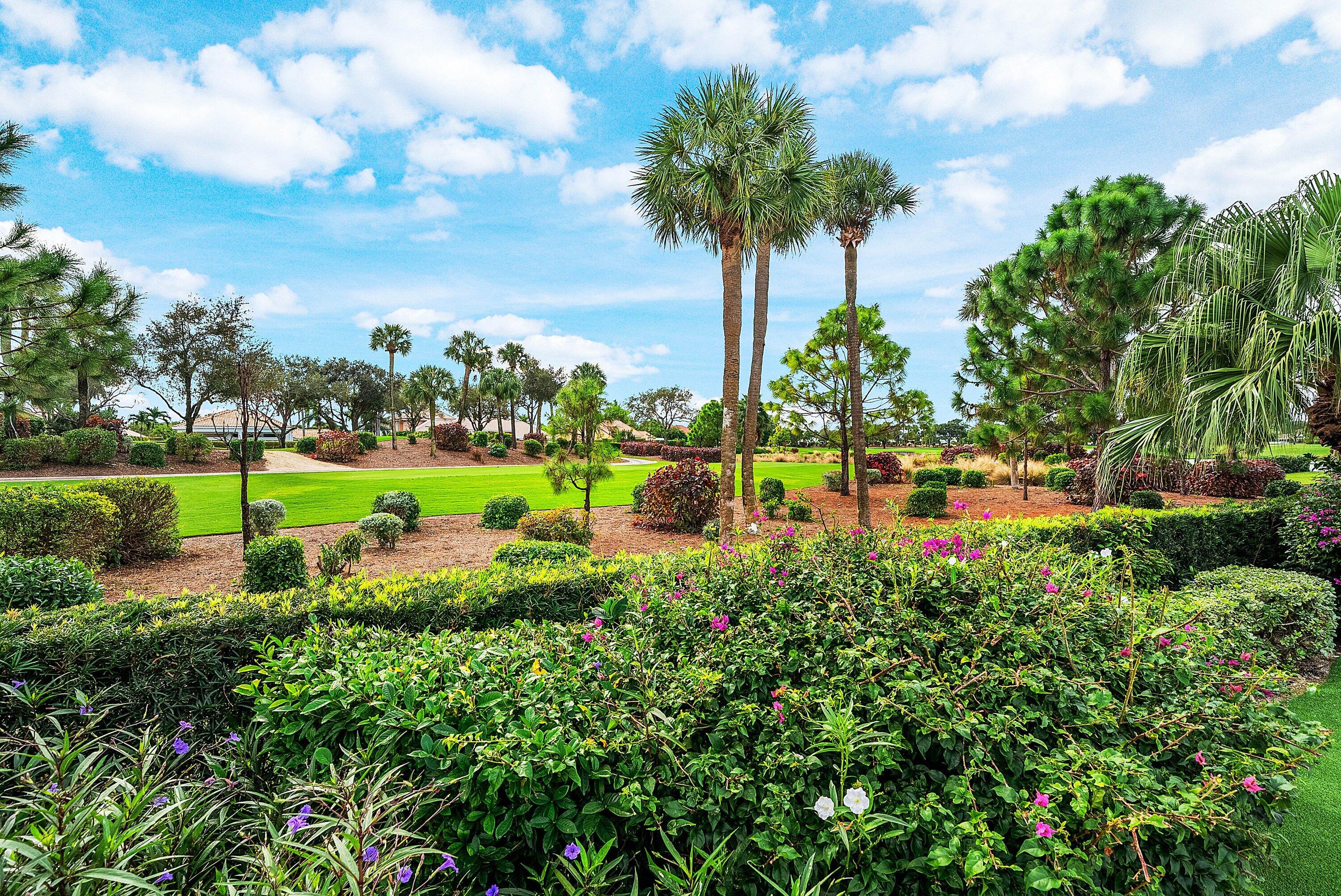 4199 Bocaire Boulevard Boca Raton, FL 33487 - Photo 47 of 82 a view of a garden with a tree in front of the house