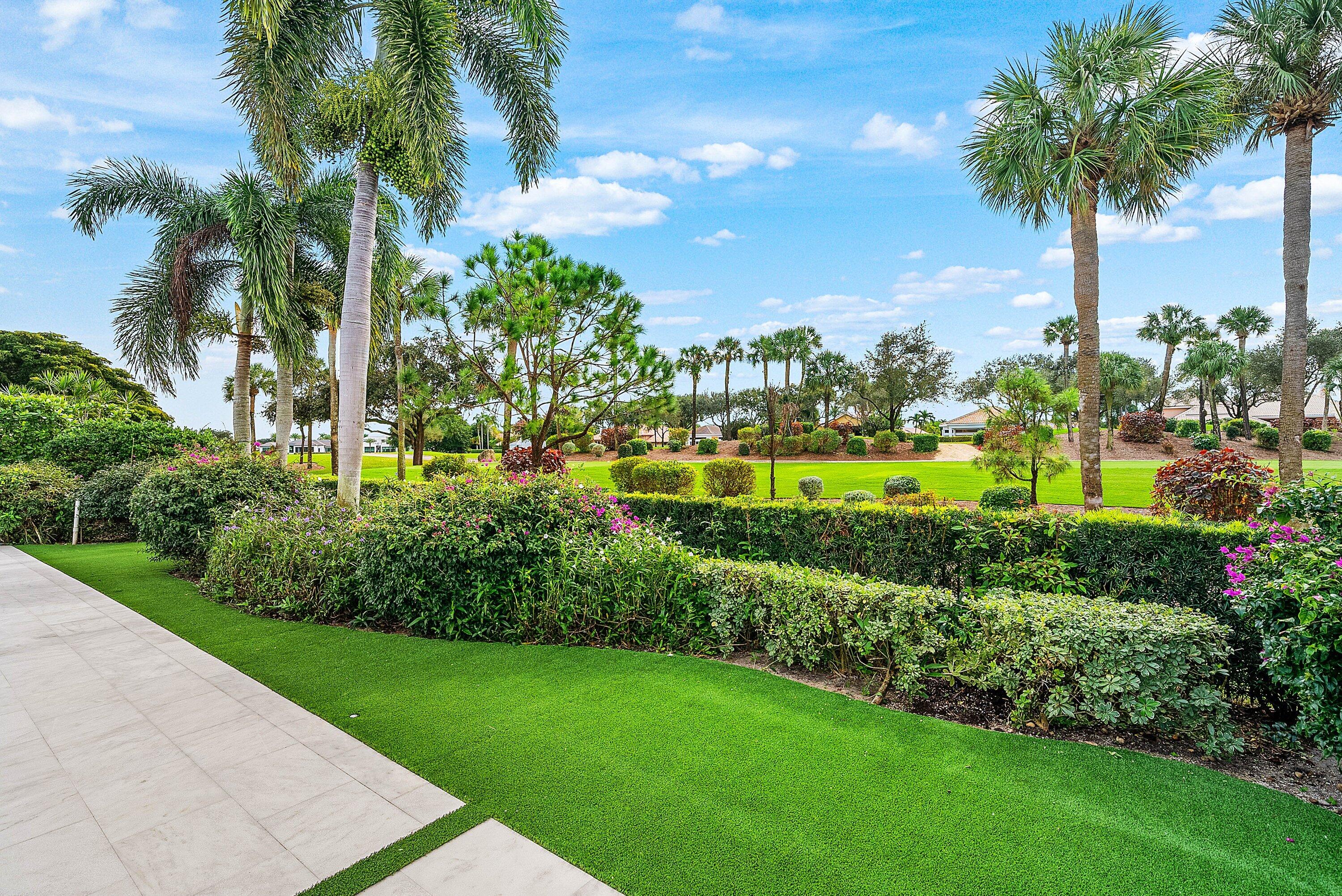 4199 Bocaire Boulevard Boca Raton, FL 33487 - Photo 48 of 82 a view of a garden with a palm tree