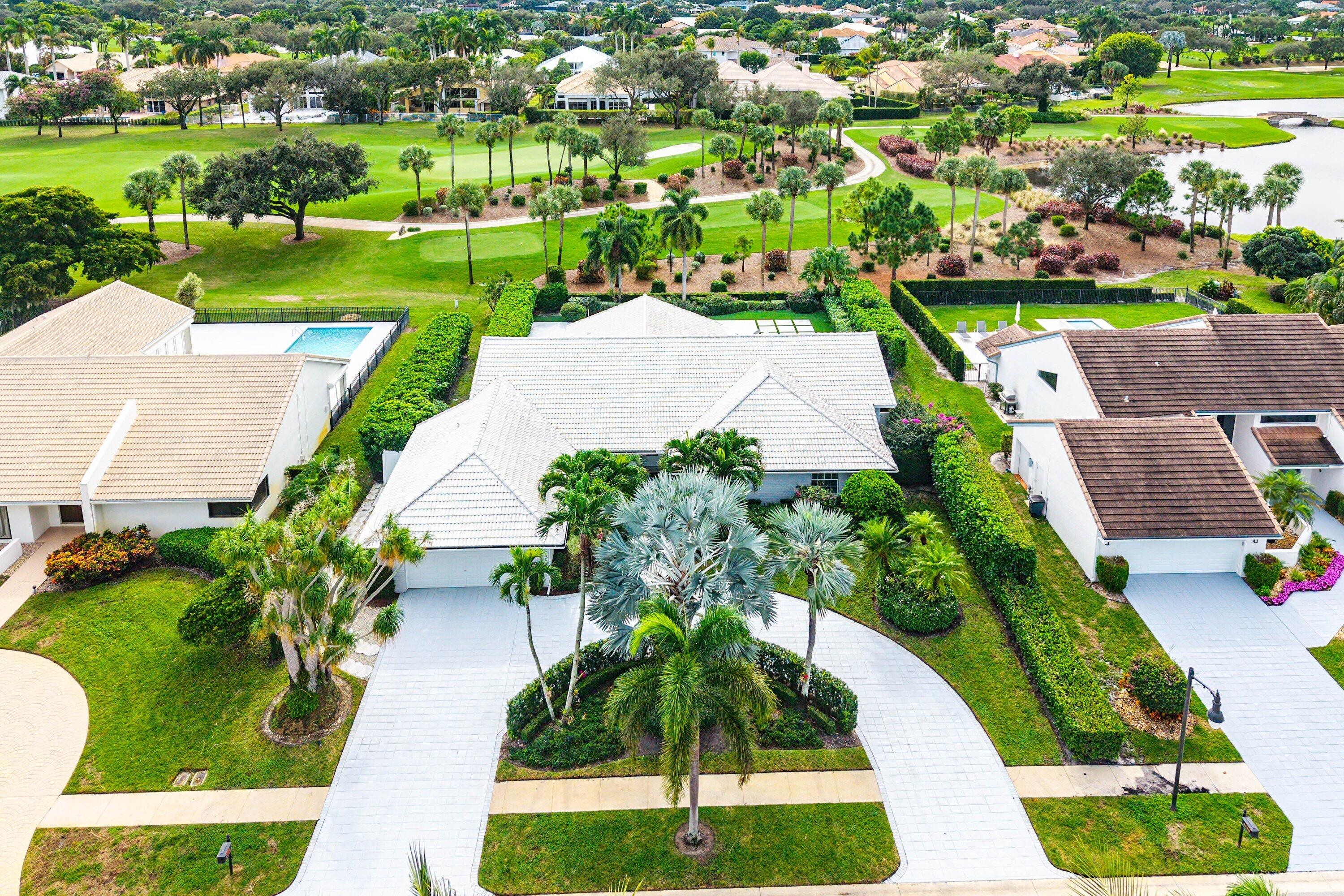 4199 Bocaire Boulevard Boca Raton, FL 33487 - Photo 54 of 82 an aerial view of a house with a yard and lake view in back yard