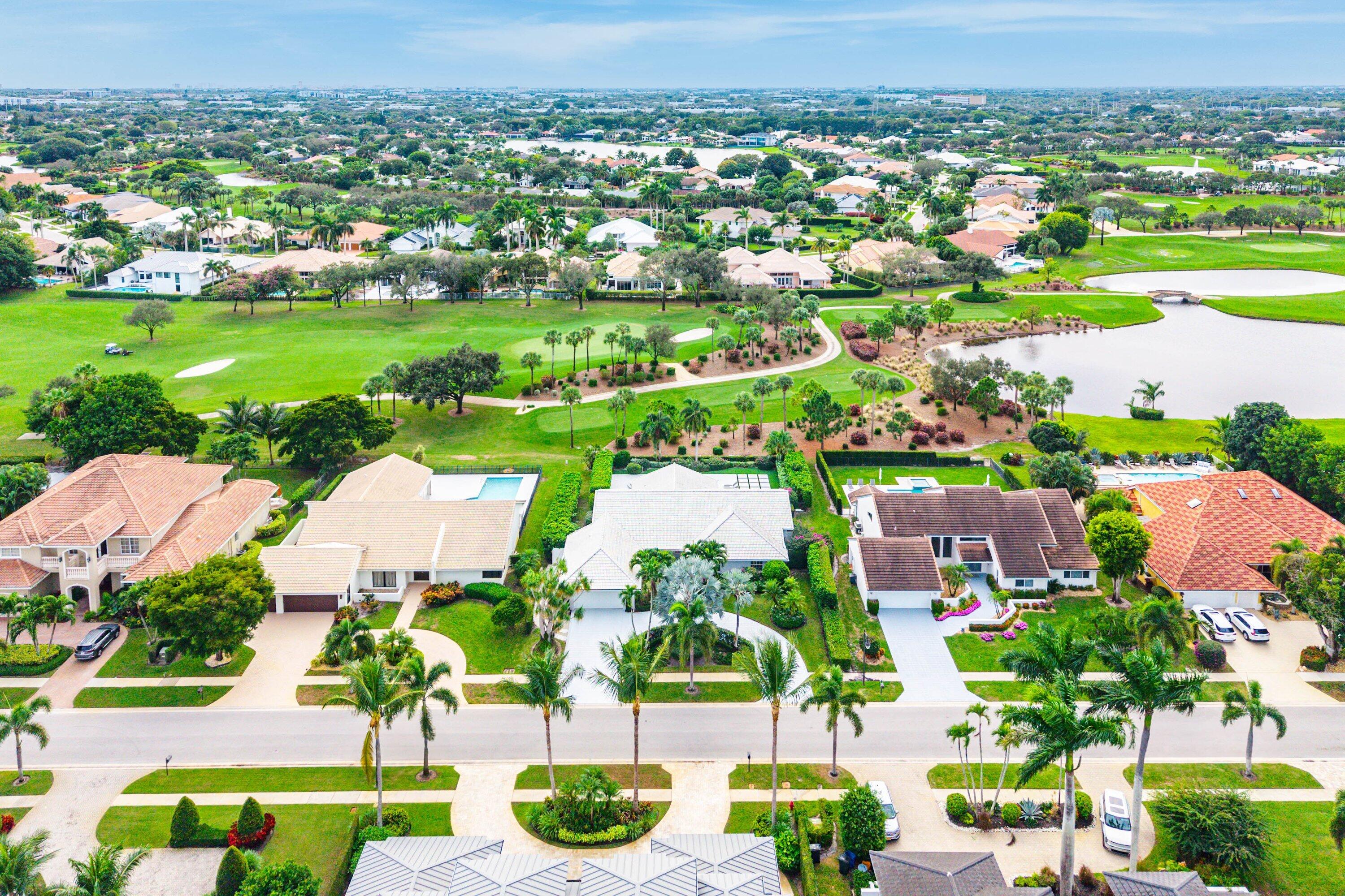 4199 Bocaire Boulevard Boca Raton, FL 33487 - Photo 60 of 82 an aerial view of residential houses with outdoor space and river