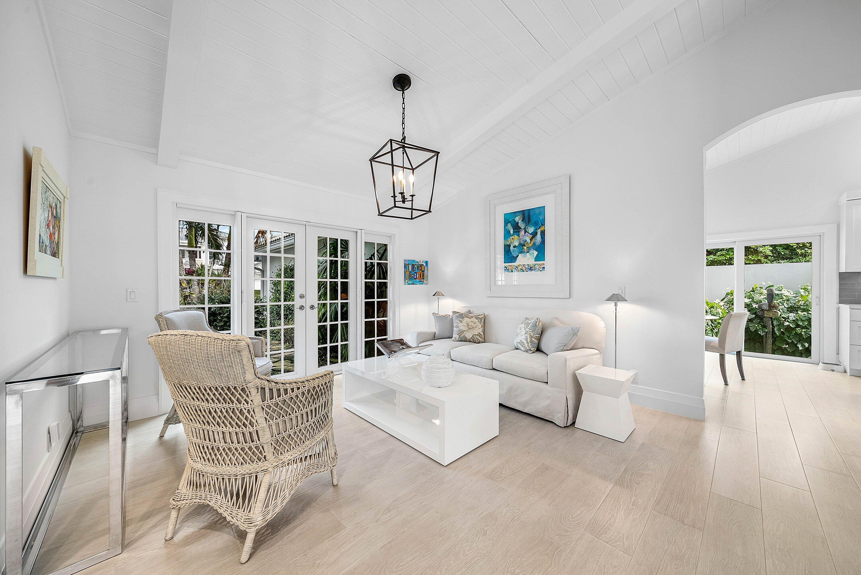 4199 Bocaire Boulevard Boca Raton, FL 33487 - Photo 8 of 82 a living room with furniture a dining table and a potted plant