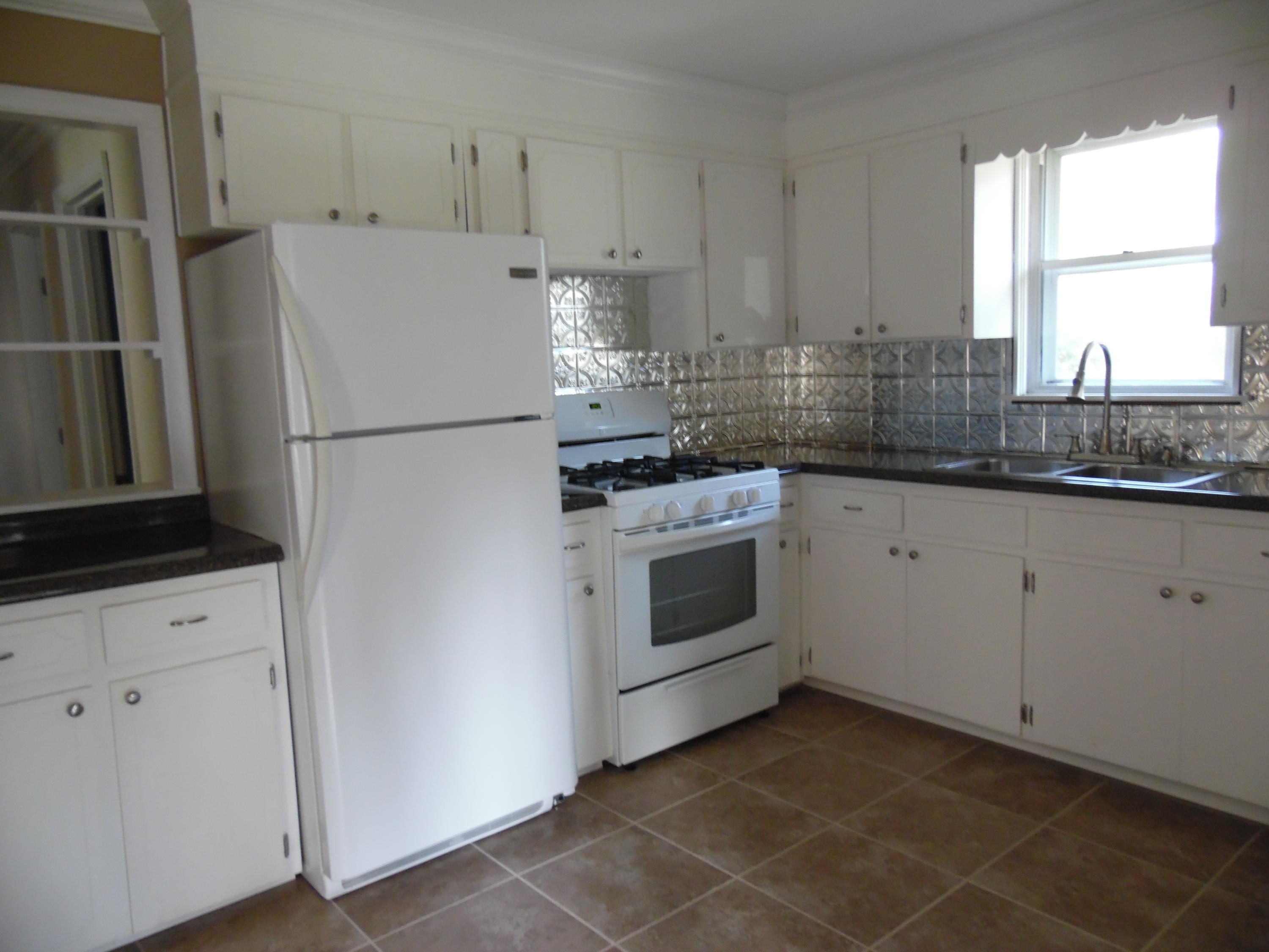 4005 King Lake Road DeFuniak Springs, FL 32433 - Photo 13 of 35 a kitchen with a white stove top oven and refrigerator