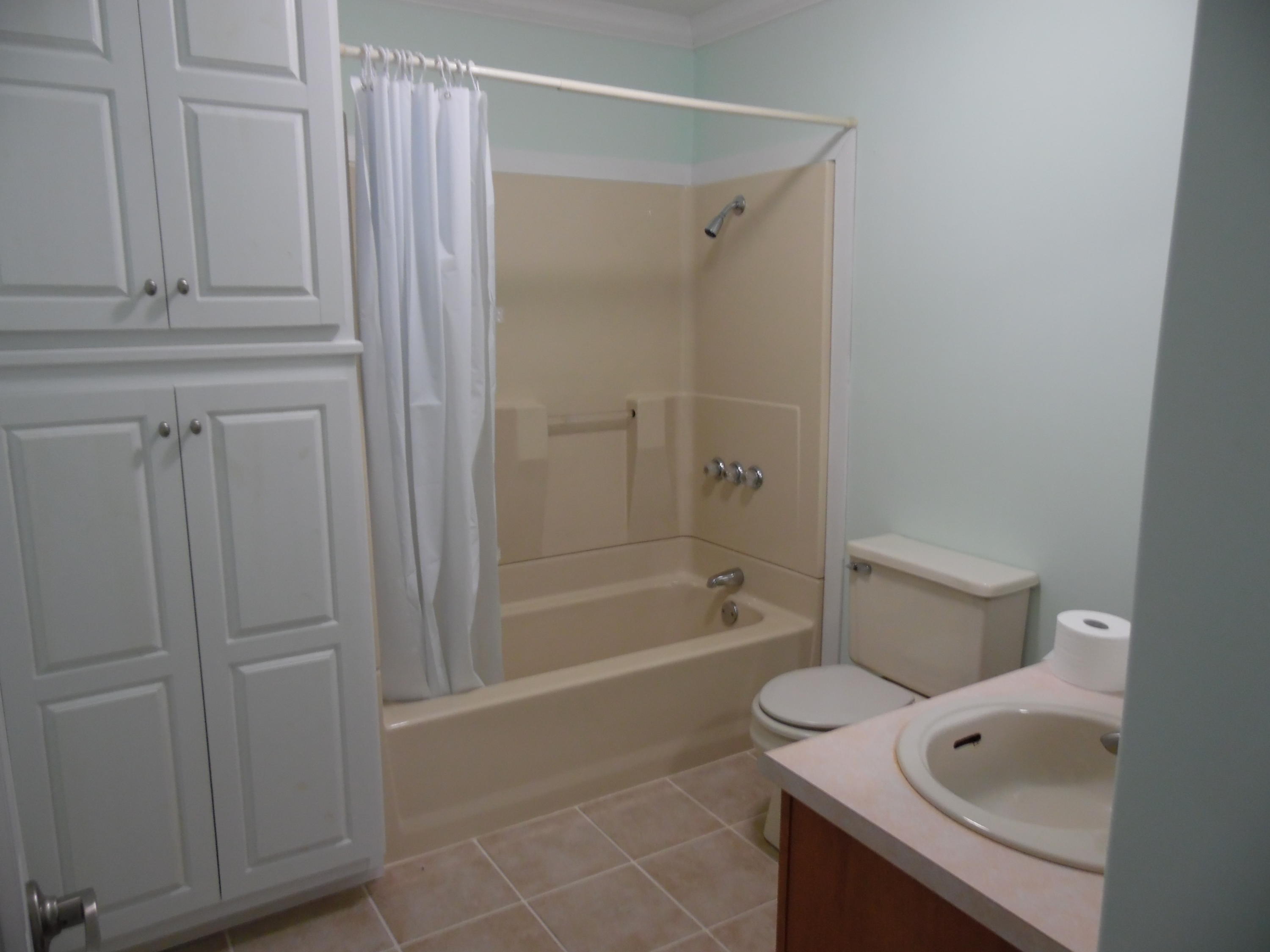 4005 King Lake Road DeFuniak Springs, FL 32433 - Photo 18 of 35 a bathroom with a shower a toilet and sink