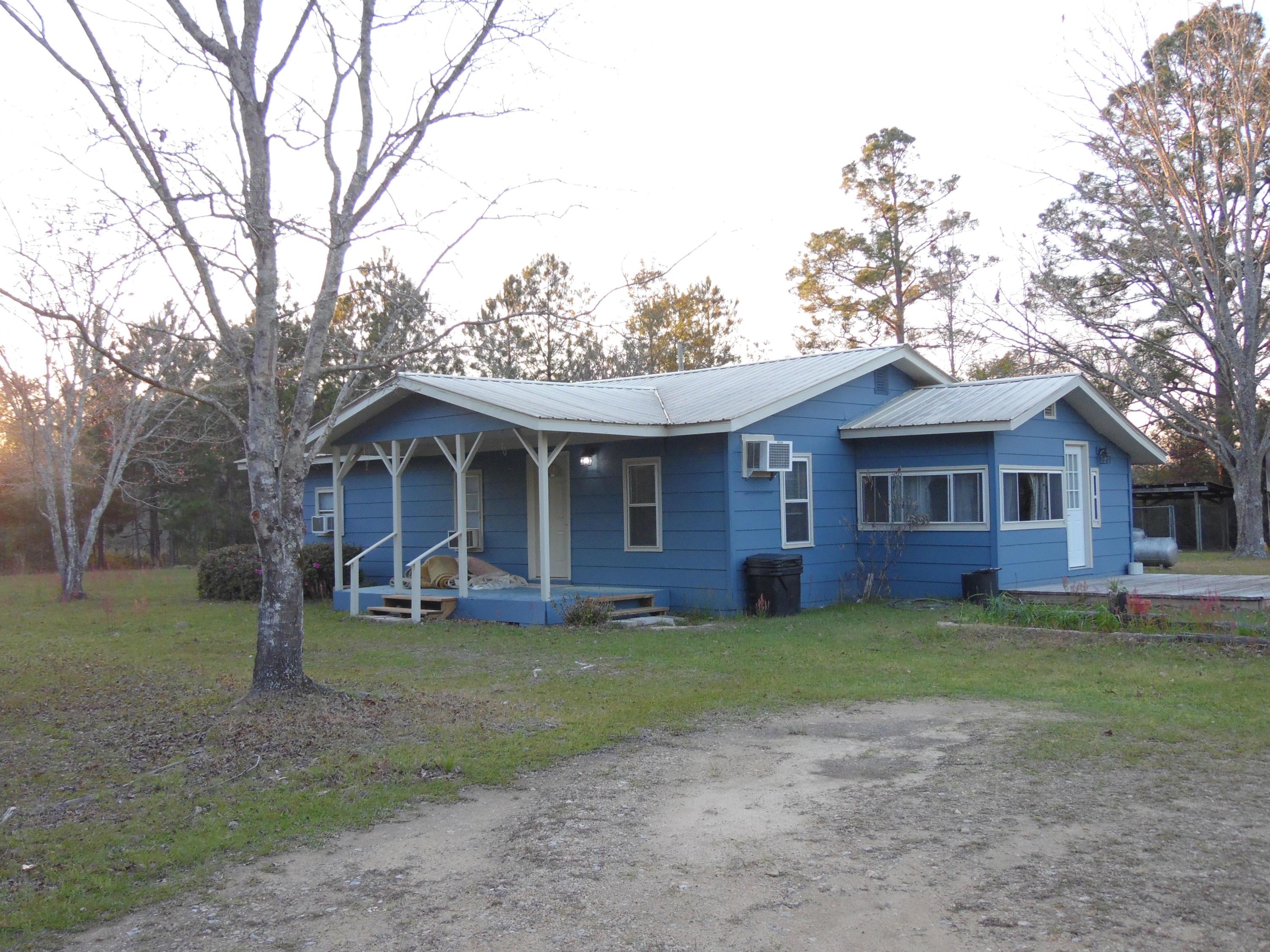 4005 King Lake Road DeFuniak Springs, FL 32433 - Photo 2 of 35 a view of a house with a yard