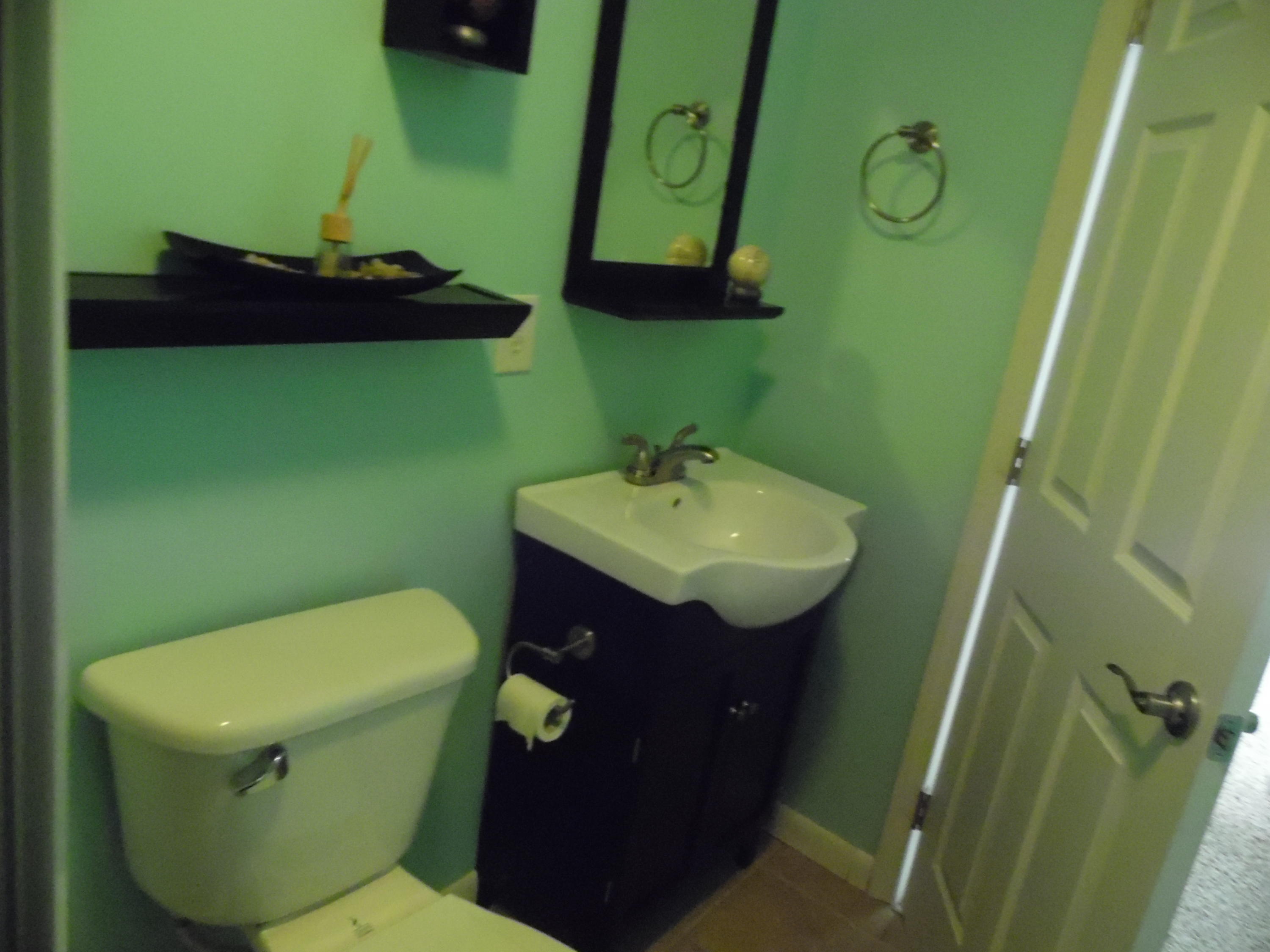 4005 King Lake Road DeFuniak Springs, FL 32433 - Photo 21 of 35 a bathroom with a toilet sink and mirror