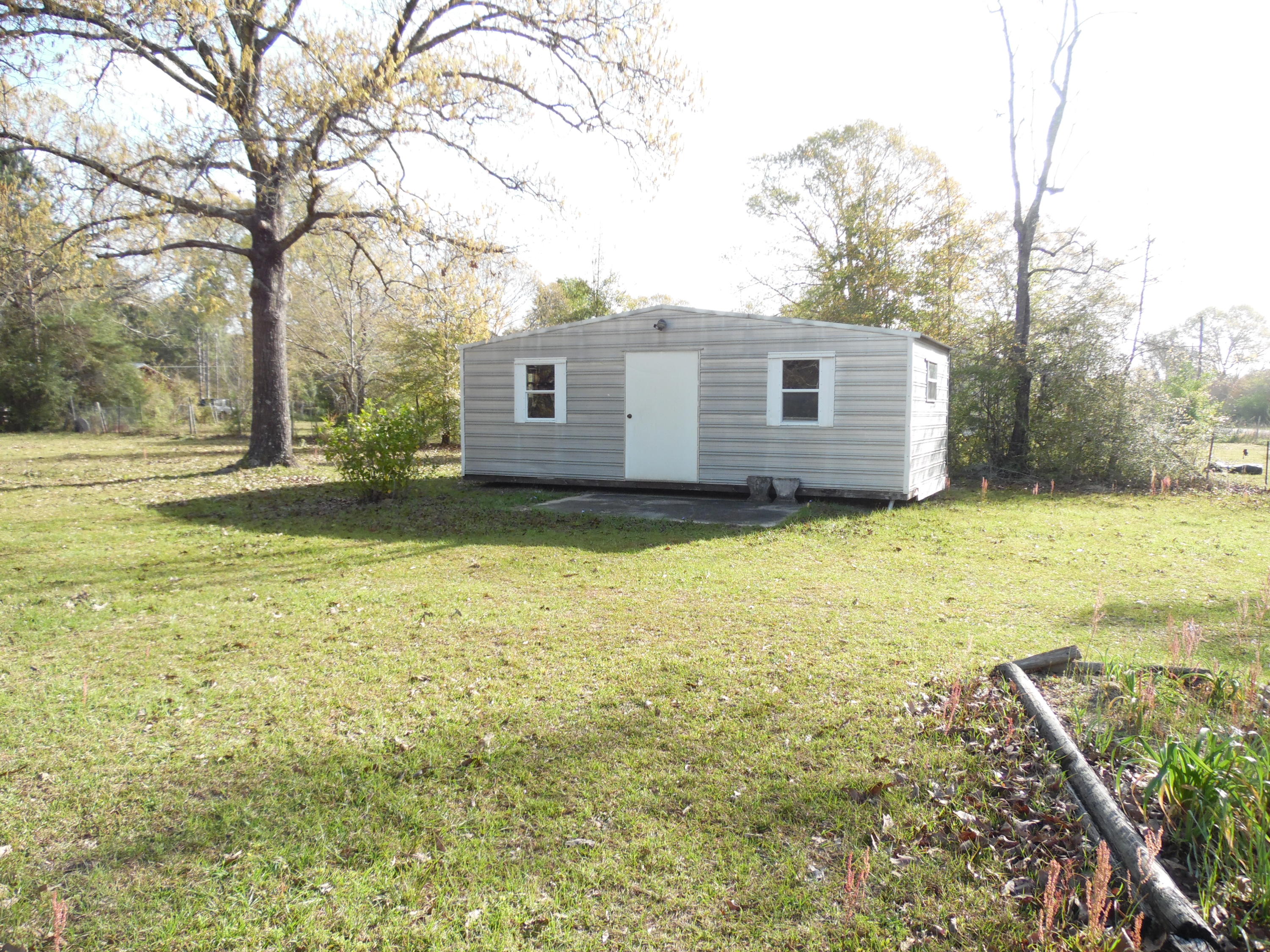4005 King Lake Road DeFuniak Springs, FL 32433 - Photo 25 of 35 a view of a house with a yard