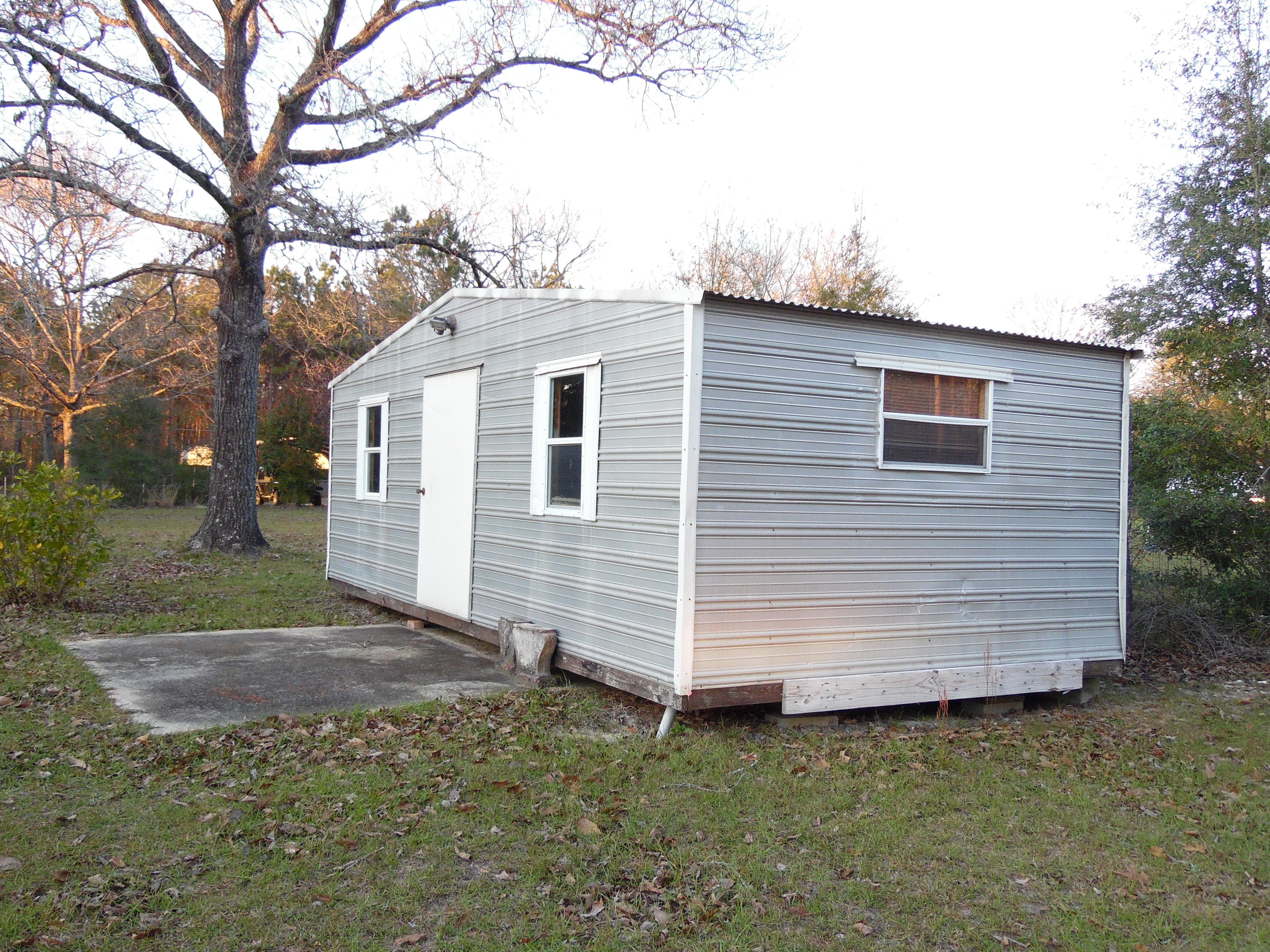 4005 King Lake Road DeFuniak Springs, FL 32433 - Photo 27 of 35 a view of a small house and a yard