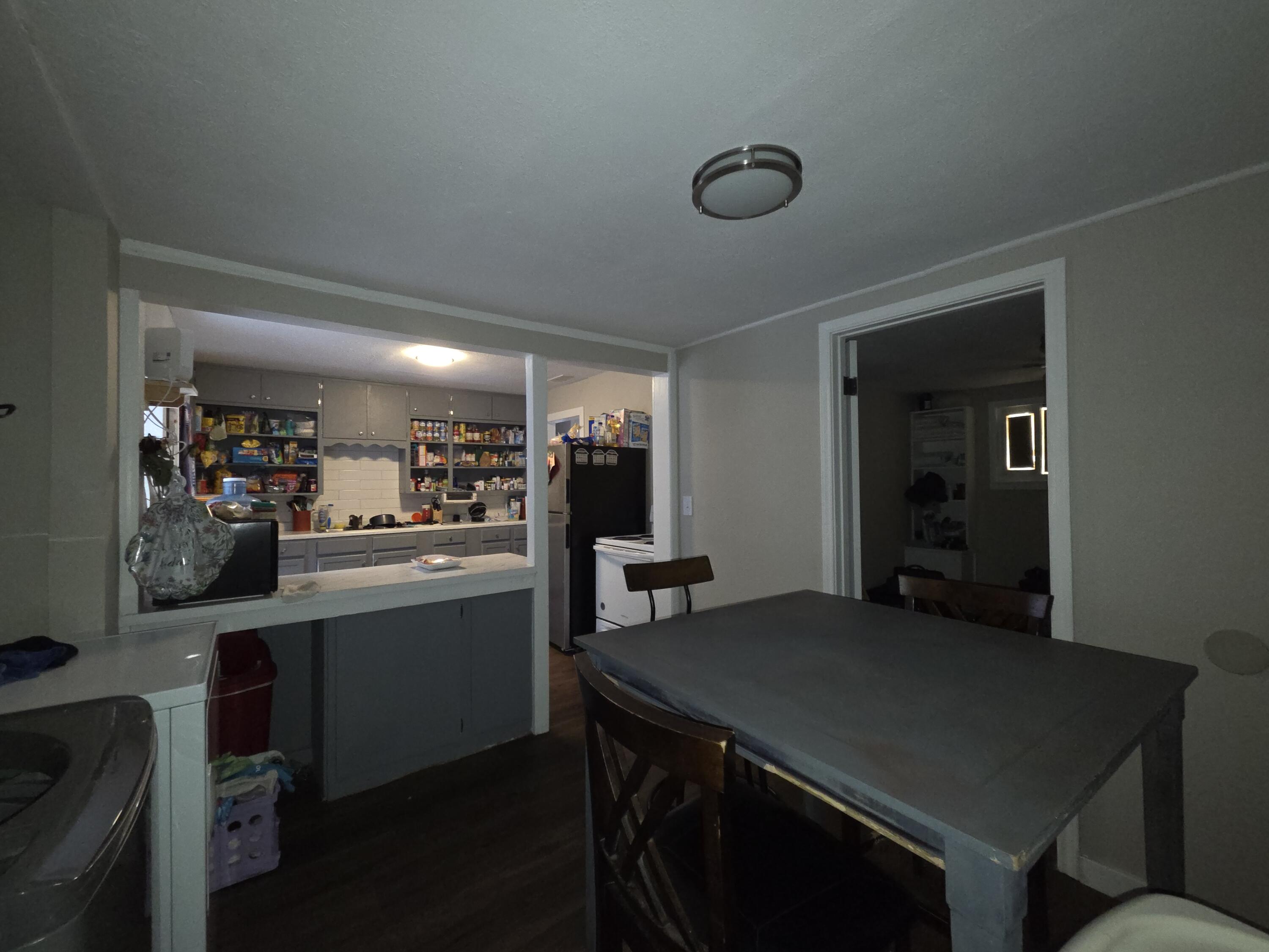 3308 2nd Street Lubbock, TX 79415 - Photo 4 of 6 a kitchen with a table and chairs in it