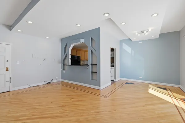 a view of a livingroom with wooden floor