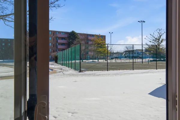 a view of a city from a corridor