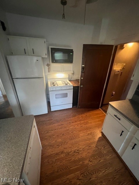 2915 Ludlow Road Cleveland, OH 44120 - Photo 11 of 50 Kitchen featuring white cabinetry, fridge, white range oven, and dark wood-style flooring
