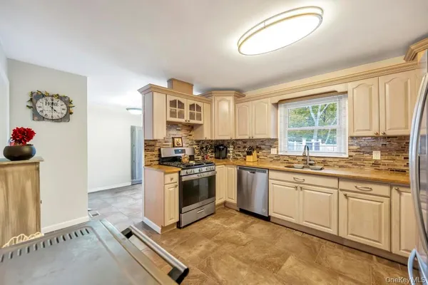 $599,999 | 45 Floradora Drive, Mastic, NY 11950