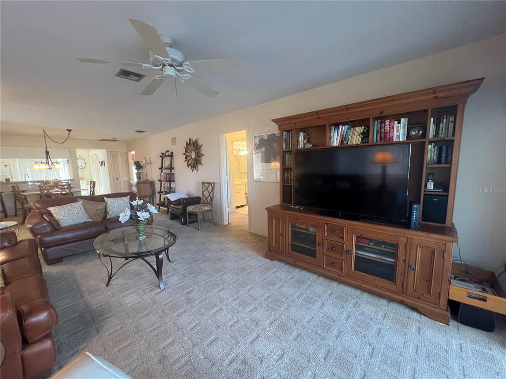 338 Cerromar Way, Unit 4 Venice, FL 34293 - Photo 11 of 41 a living room with furniture and a flat screen tv