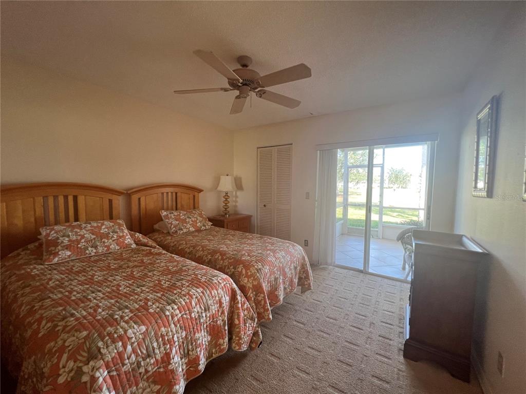 338 Cerromar Way, Unit 4 Venice, FL 34293 - Photo 15 of 41 a bedroom with two beds and a window
