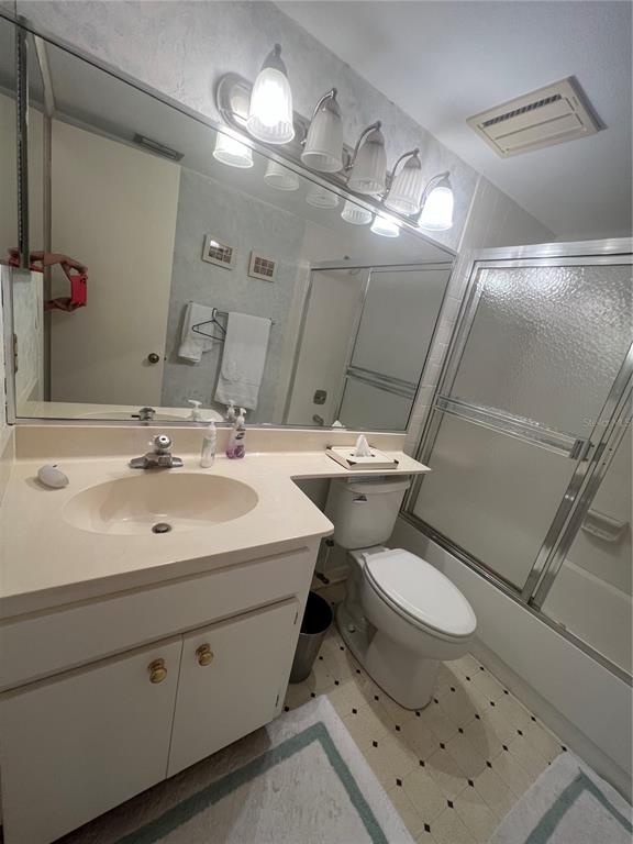 338 Cerromar Way, Unit 4 Venice, FL 34293 - Photo 19 of 41 a bathroom with a sink toilet and a mirror