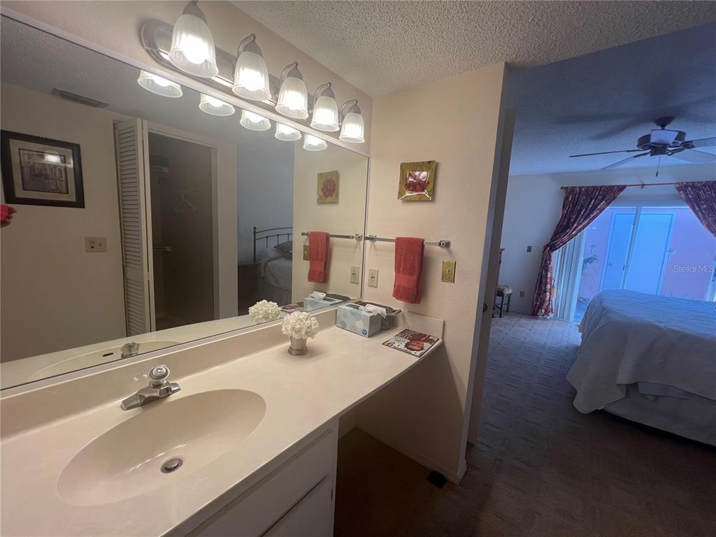338 Cerromar Way, Unit 4 Venice, FL 34293 - Photo 29 of 41 a bathroom with a sink and a mirror