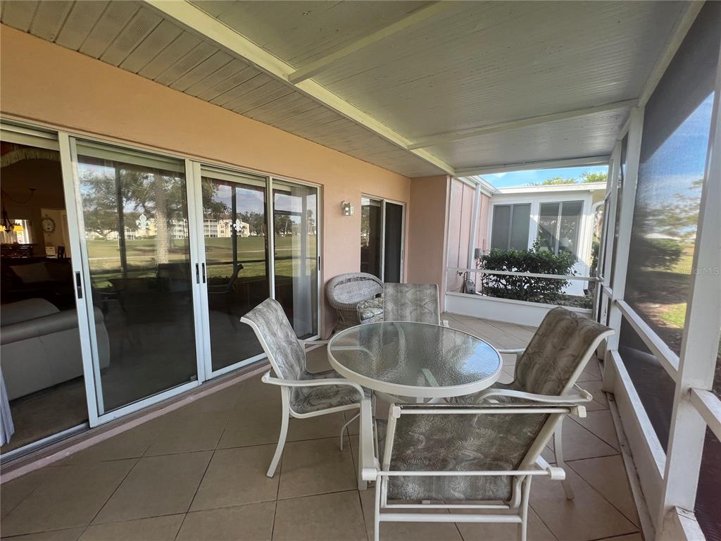 338 Cerromar Way, Unit 4 Venice, FL 34293 - Photo 35 of 41 a kitchen with a table and chairs